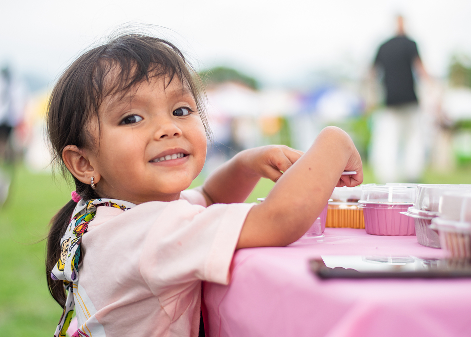 Smiling young girl at a community outreach event